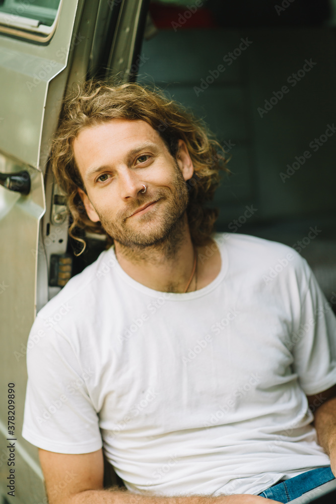 Young Man relaxing in the summer in his Van Young Man relaxing in the summer in his Van