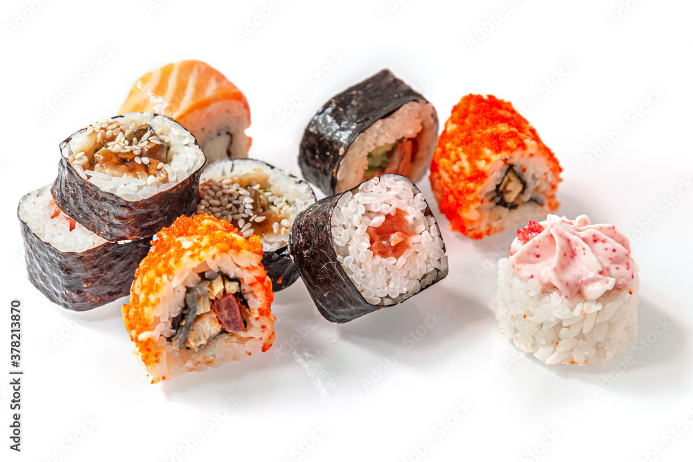 assorted japanese rolls on a light glass surface close up assorted japanese rolls on a light glass surface close up
