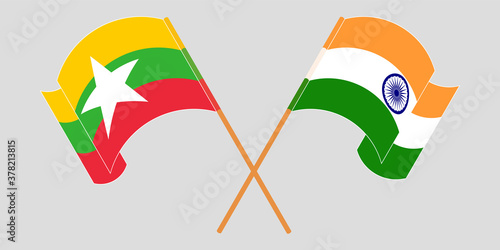 Crossed and waving flags of Myanmar and India