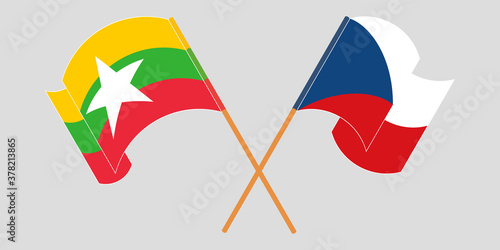Crossed and waving flags of Myanmar and Czech Republic