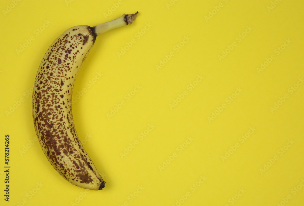 View on one isolated old ripe yellow brown banana with background and blank copy space for text View on one isolated old ripe yellow brown banana with background and blank copy space for text
