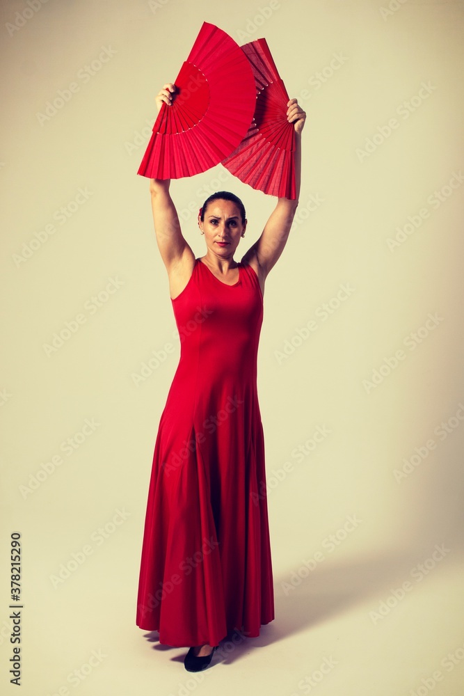 woman with red fan and red dress dancing flamenco and sevillanas woman with red fan and red dress dancing flamenco and sevillanas