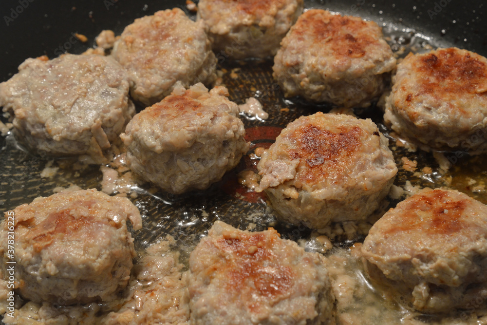 Meat cutlets are fried in frying pan. Meat cutlets are fried in frying pan.