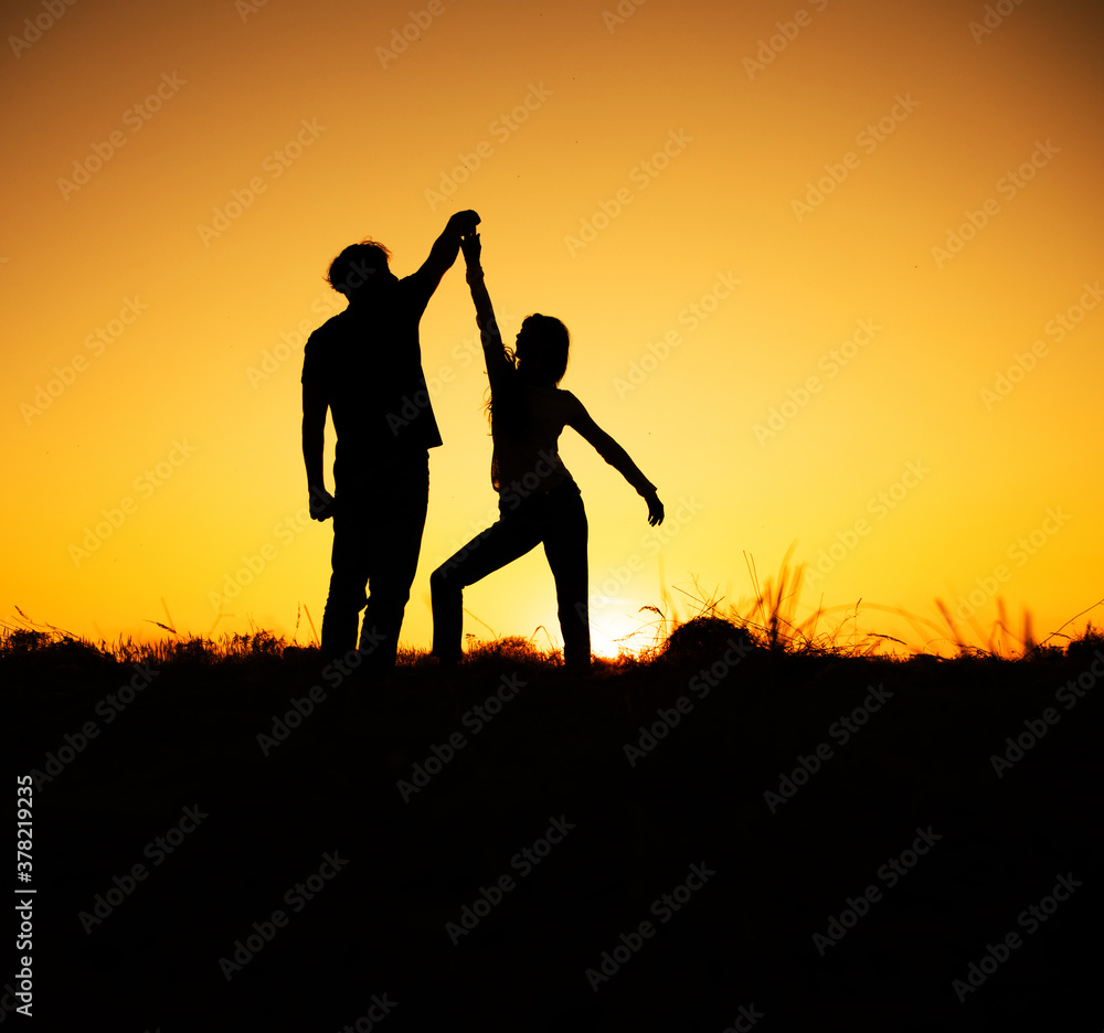 Couple dancing salsa at sunset. Love couple. Dance. Sunset. Lovely. 
