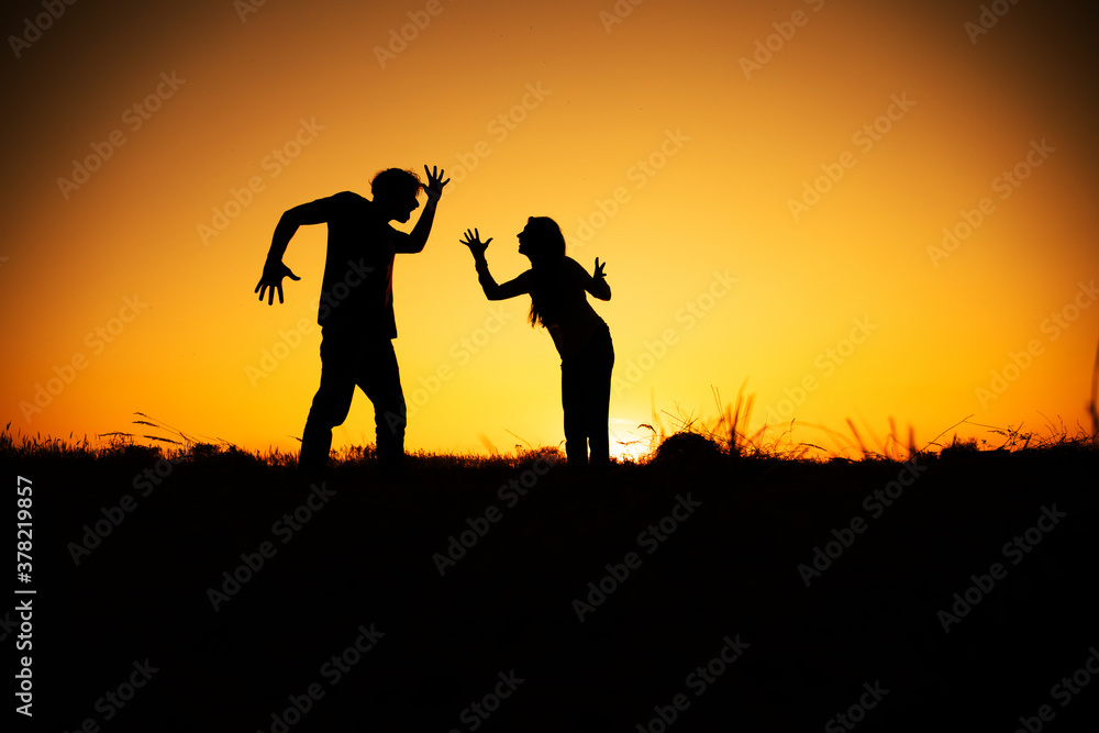 Silhouette of a angry woman and man on each other.Relationship difficulties Silhouette of a angry woman and man on each other.Relationship difficulties
