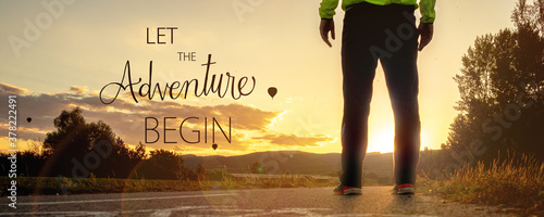 Fotografie let the adveture begin quote concept with sunset cyclo way with a man silhouette