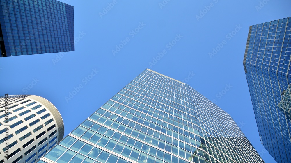 Bottom view of modern office buildings in the business district Bottom view of modern office buildings in the business district