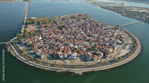 Aerial drone view of the famous island - fishing village of Aitoliko in Aetolia - Akarnania, Greece situated in the middle of Messolongi archipelago known as the Little Venice of Greece photo