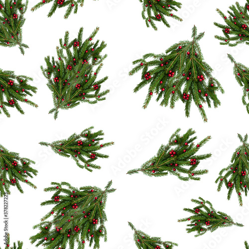 Seamless texture of a natural christmas tree branch with red balls of berries