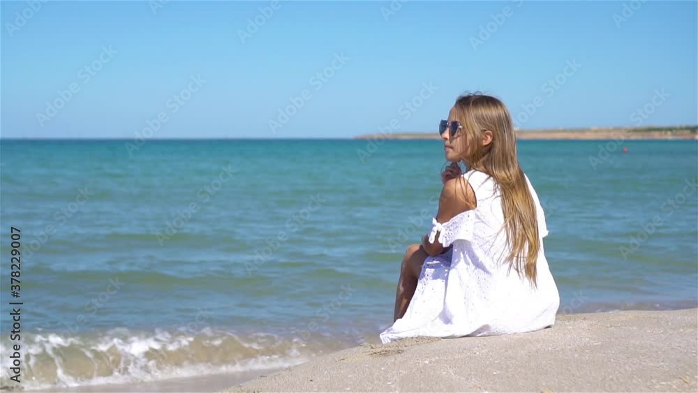 Cute little girl at beach during summer vacation Cute little girl at beach during summer vacation