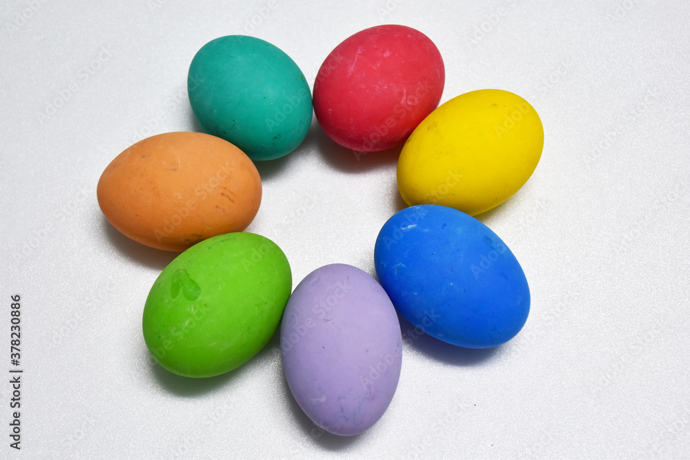 Variety of colorful Easter eggs on white background, selective focus Variety of colorful Easter eggs on white background, selective focus