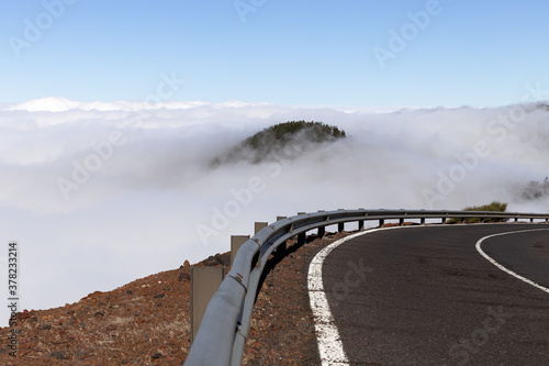 Winding mountain road above the clouds on the island of Tenerife