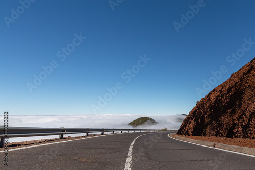 Winding mountain road above the clouds on the island of Tenerife