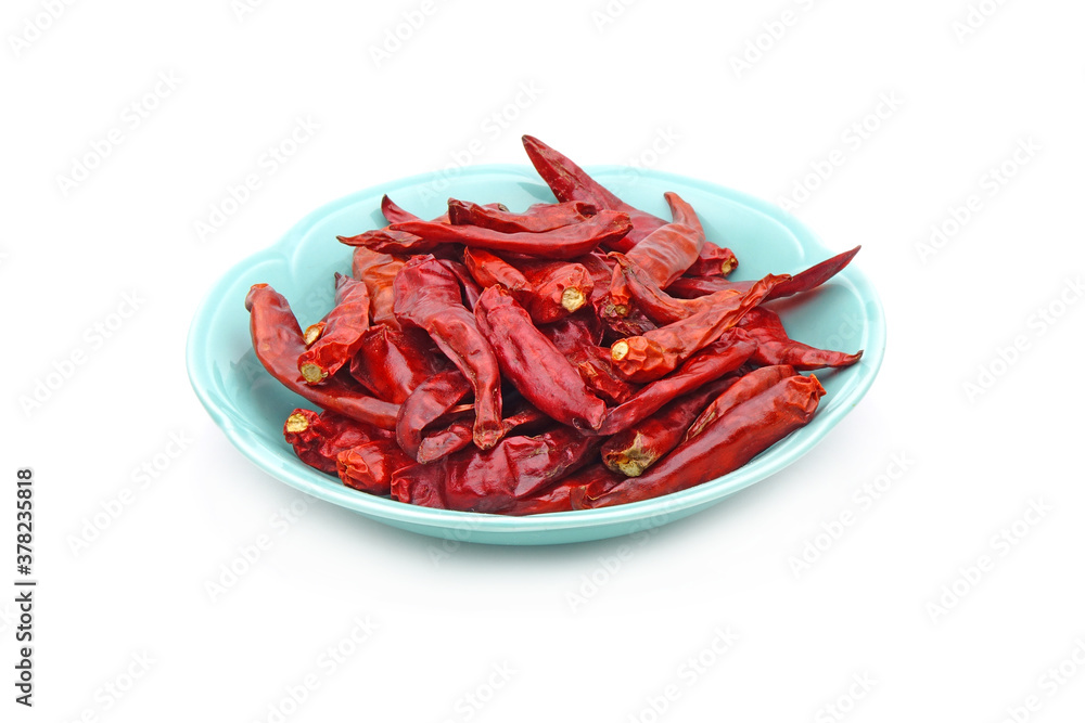 Dried red hot chili peppers in ceramic dish isolated on white background Dried red hot chili peppers in ceramic dish isolated on white background