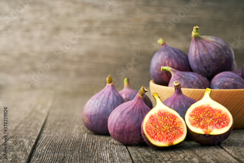 fresh figs on a wooden table , with copy space. photo