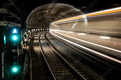 Railway tunnel with train in motion