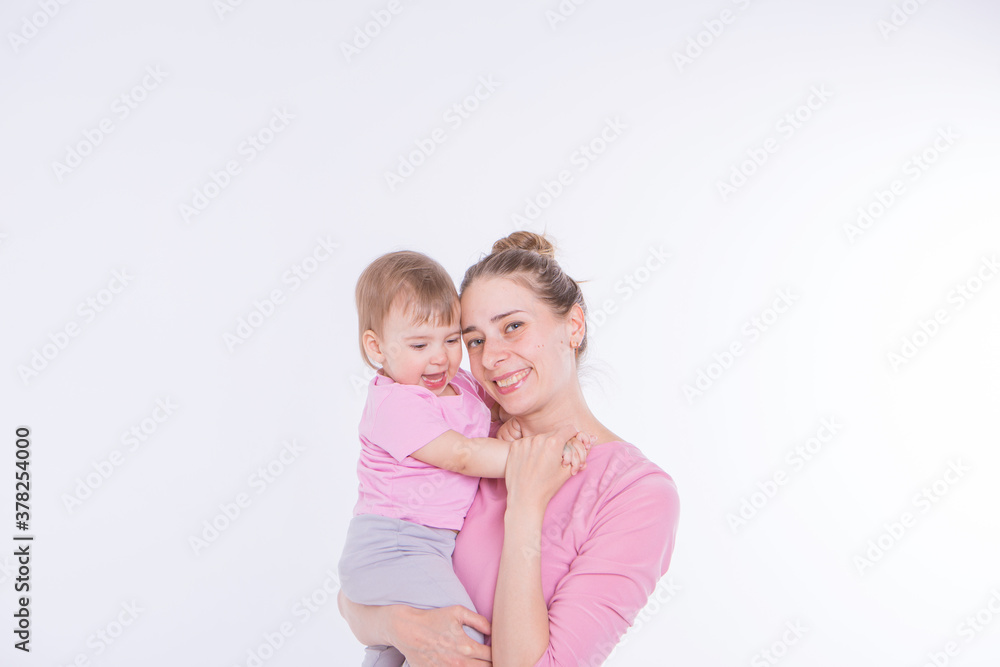 the concept of a healthy lifestyle, the protection of children, shopping - baby in the arms of the mother. Woman holding a child the concept of a healthy lifestyle, the protection of children, shopping - baby in the arms of the mother. Woman holding a child