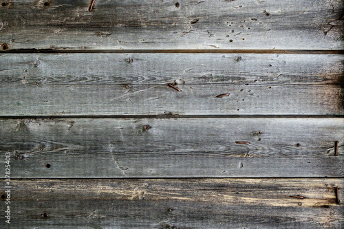 Texture of old wooden boards with rusty nails.