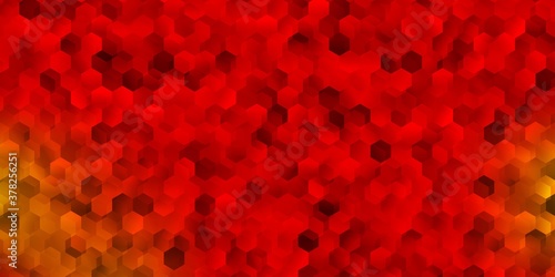 Light red, yellow vector background with hexagonal shapes.