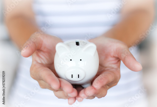 Saving pig piggy bank in hand Convey to savings