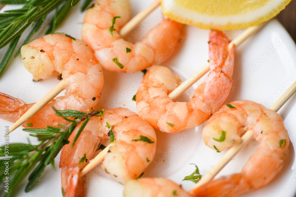 Salad grilled shrimp skewers delicious seasoning spices on white plate appetizing cooked shrimps baked prawns , Seafood shelfish with rosemary and lemon / Salad grilled shrimp skewers delicious seasoning spices on white plate appetizing cooked shrimps baked prawns , Seafood shelfish with rosemary and lemon /