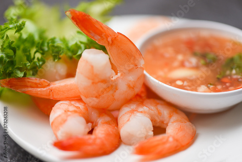 Shrimp delicious seasoning spices on white plate appetizing cooked boiled shrimps prawns , salad shelfish seafood sauce /
