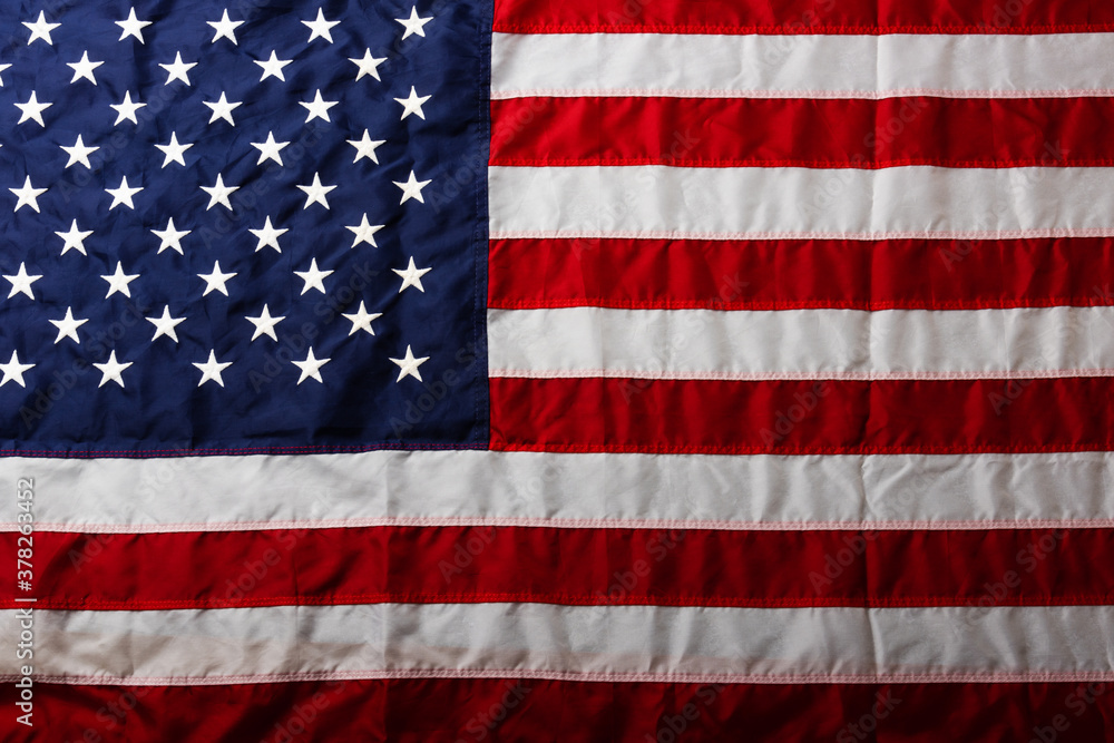 Naklejka premium White embroidered star on the blue of the full America United States flag, symbolizing background for use, US Veterans or Independence day concept