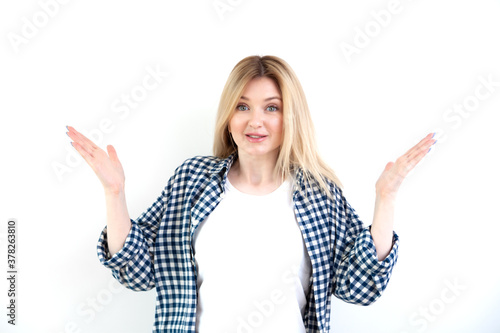 Surprized young beautiful woman in casual clothes on white background