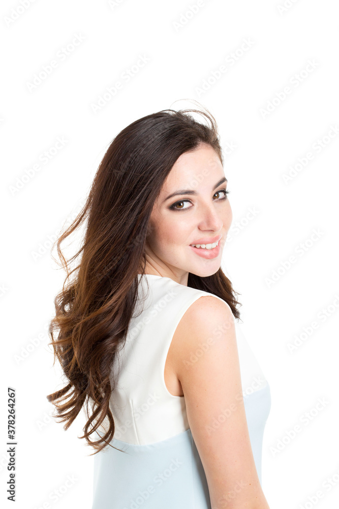 Portrait of a beautiful smiling woman with fluttering hair in studio. Portrait of a beautiful smiling woman with fluttering hair in studio.