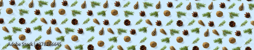 Pine cone Christmas background on blue. Pine branches and cones. minimal creative cone arrangement pattern. flat lay, Modern christmas Background.