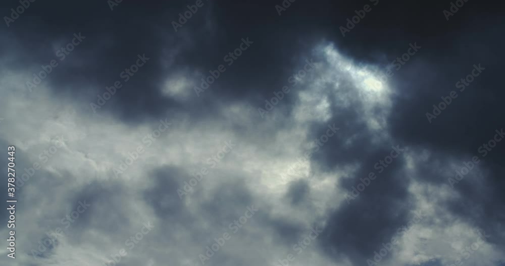 A dark cloud moves in the sky before the sun. A dark cloud moves in the sky before the sun.