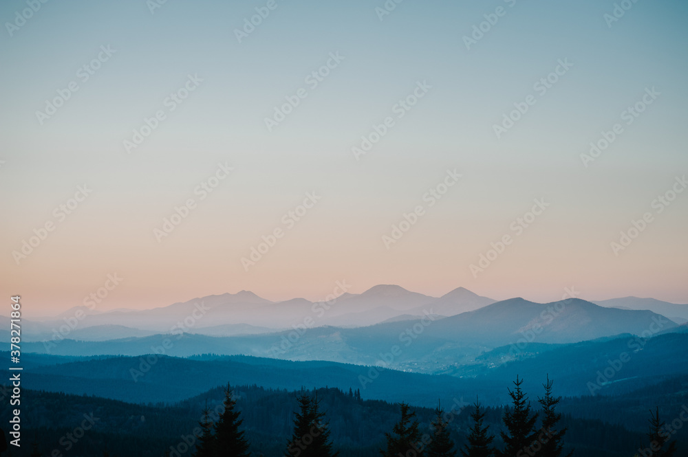 Silhouette of mountains, blue foggy mountains with mist and fog.