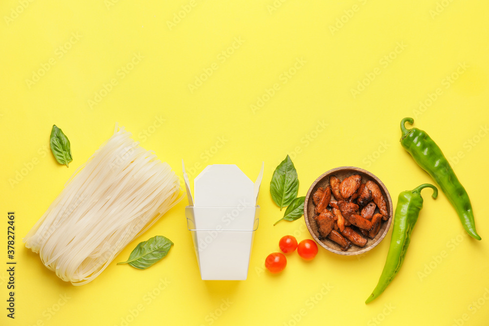 Raw rice noodles with ingredients on color background Raw rice noodles with ingredients on color background