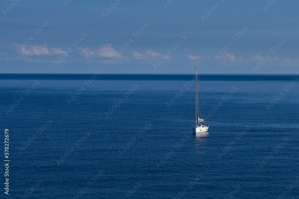 White yacht and blue water ocean At sunrise