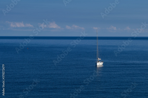 White yacht and blue water ocean At sunrise