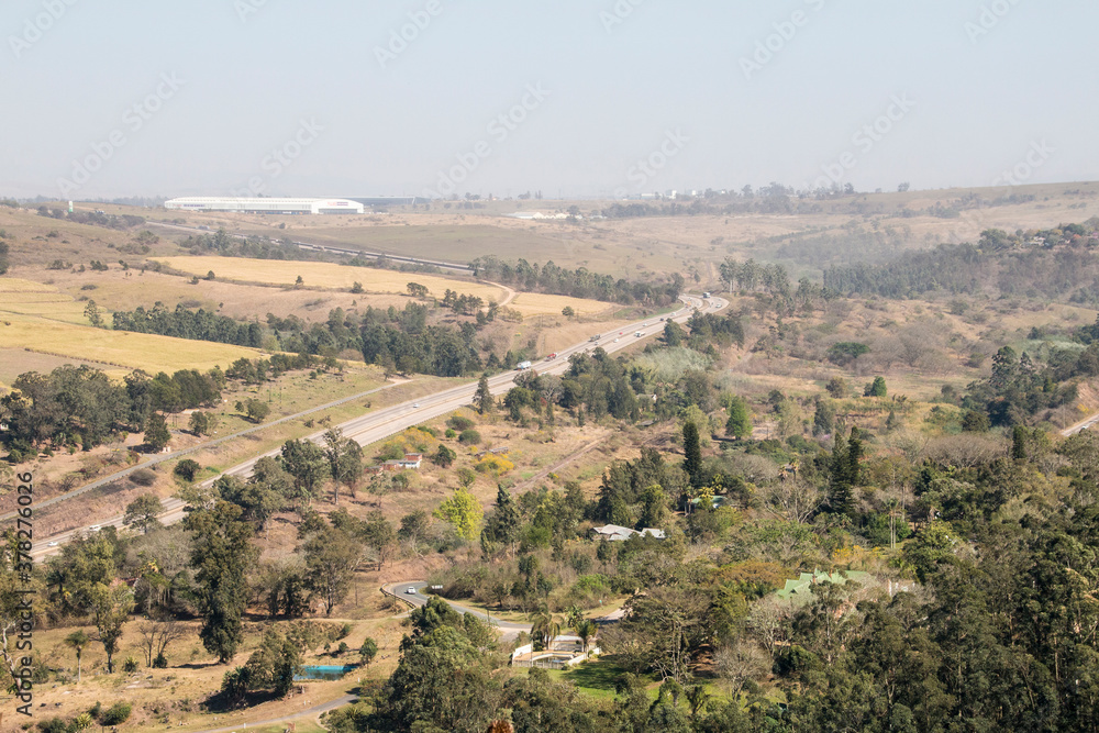 Asphalt Highway Running Through Green Vegetation in South Africa