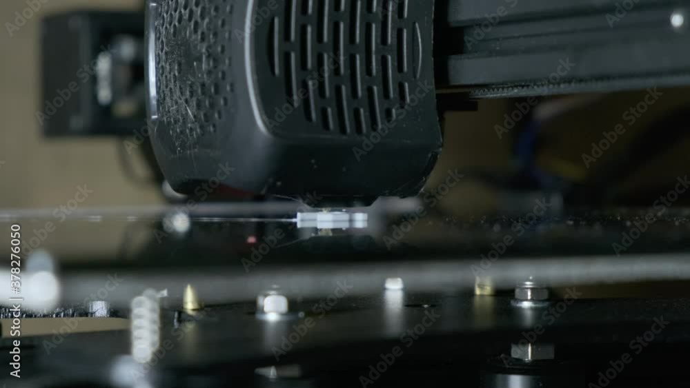 Extreme close up shot of consumer 3D printer working. 3D printing ...
