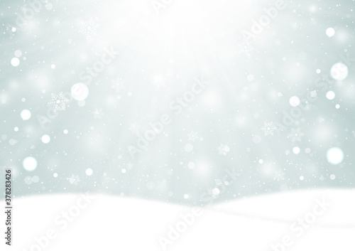 光芒と雪の結晶とふわふわの雪が降る雪原の風景　背景素材（銀色） © YX2K