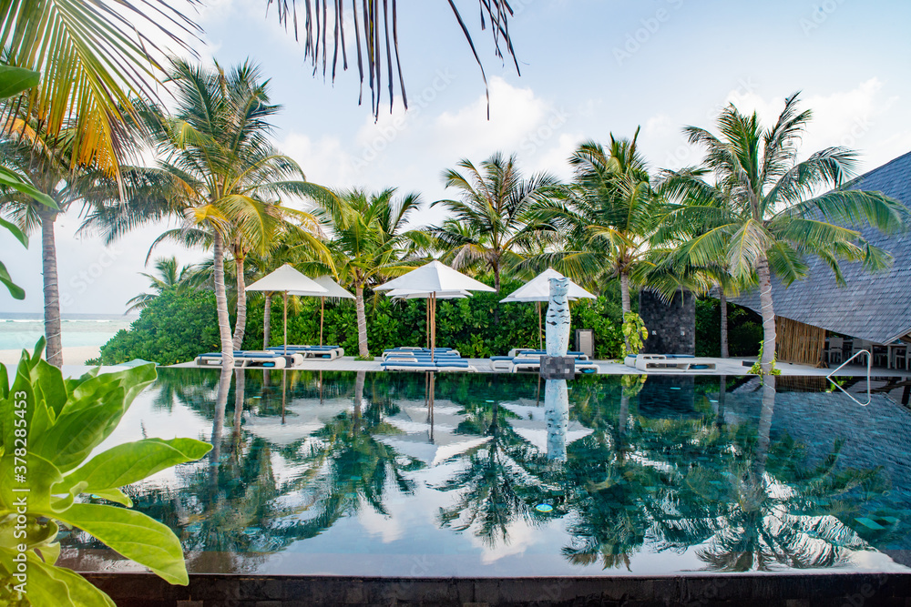 Tropical landscape with infinity pool at the luxury ilsand resort