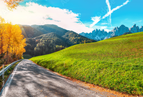 Autumn scene of  Santa Magdalena famous Italy Dolomites village view in front of the Geisler or Odle Dolomites Group mountain rocks. photo