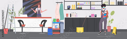 professional cleaners couple mix race janitors using cleaning equipment working together beauty salon interior full length horizontal vector illustration