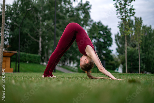 Girl practice yoga and meditation in the city.