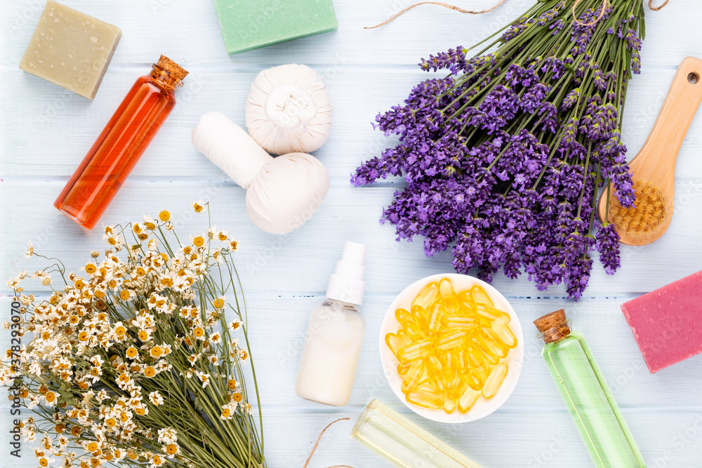 Grooming products and fresh lavender bouquet on white wooden table background. Grooming products and fresh lavender bouquet on white wooden table background.