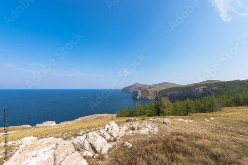 Mountain landscape of Olkhon island. Blue sky over the Maloye More Strait.