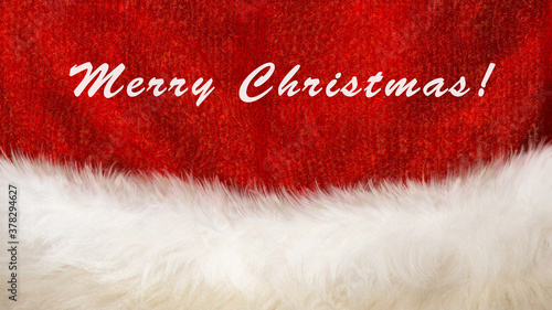 Santa Claus hat close-up. Christmas festive background. Merry Christmas  text