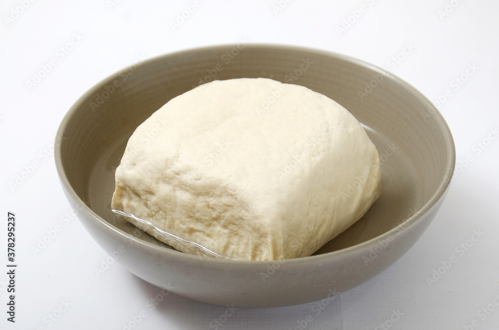 Asian Food, Indonesian Food, raw White Tofu in a ceramic bowl. Tofu made from soybean Asian Food, Indonesian Food, raw White Tofu in a ceramic bowl. Tofu made from soybean