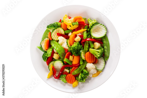 plate of stir fry vegetables isolated on a white background