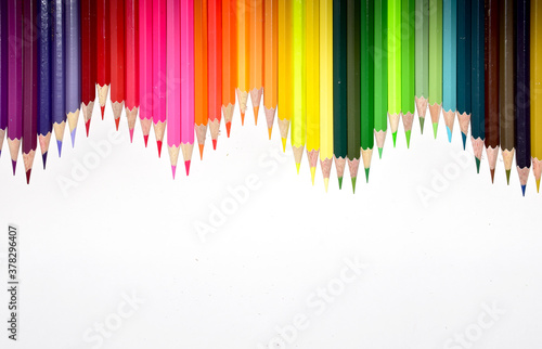 Many Color pencils isolated on white background close up. Color pencils for drawing as a background