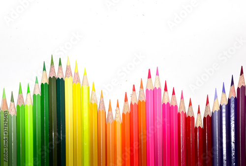 Many Color pencils isolated on white background close up. Color pencils for drawing as a background