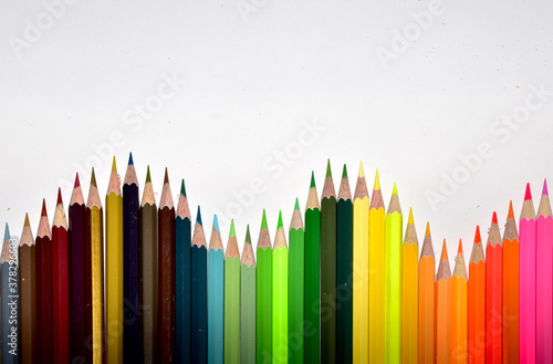 Many Color pencils isolated on white background close up. Color pencils for drawing as a background